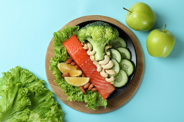 Healthy food on blue background, top view