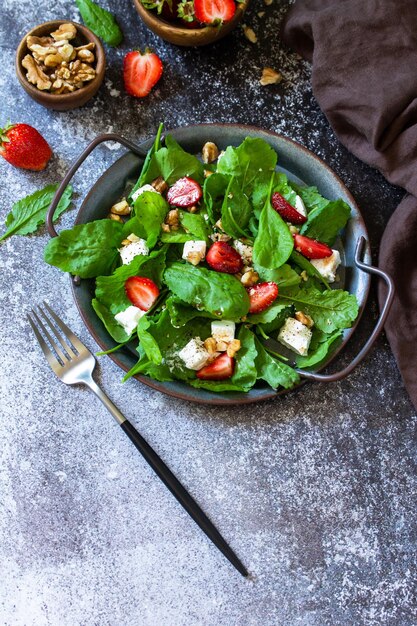 Healthy food concept Diet salad plate Summer salad with strawberries fetacheese Copy space