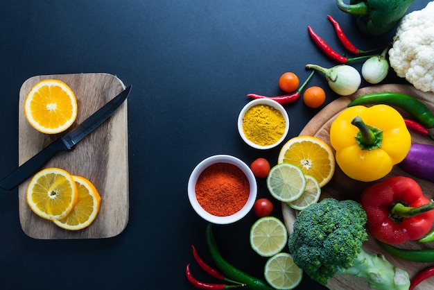 Healthy food concept of fresh organic vegetables and wooden desk background. 