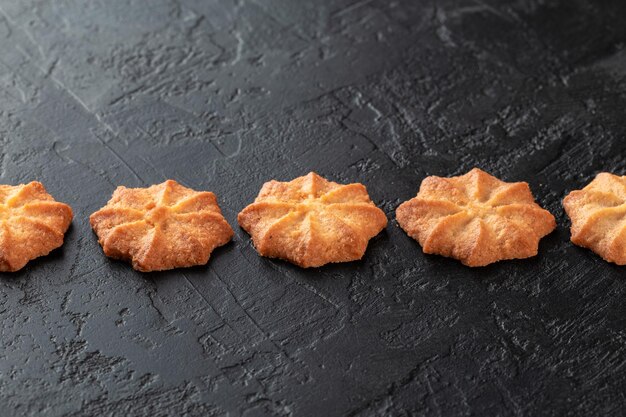 Healthy food concept Homemade organic energy cookies on black slate stone background