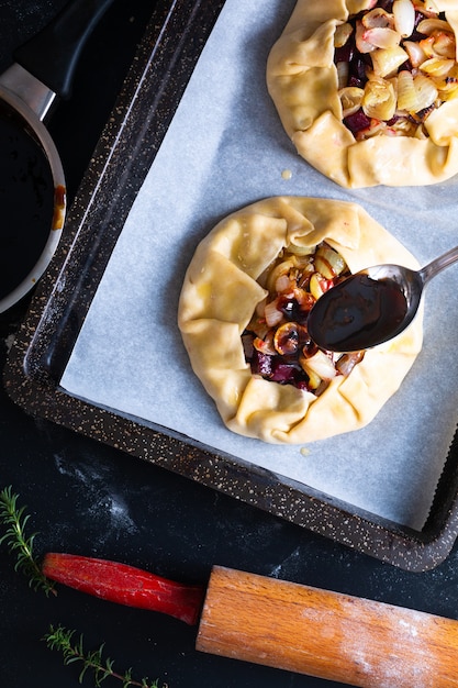 Healthy food concept preparation for Homemade rustic organic roasted beets and onion caramel galette pie