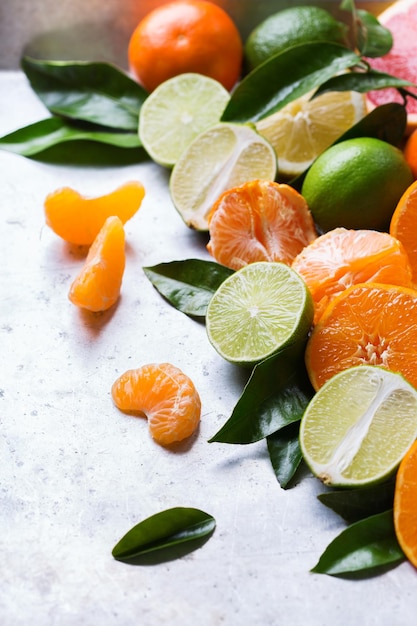 Healthy food diet nutrition nature concept Citrus fruits vitamin background Orange grapefruit tangerine lime lemon with leaves on a grunge table