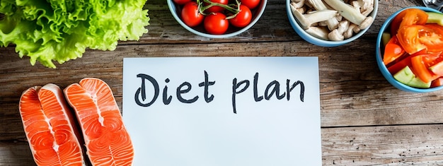 Healthy food and Diet planning Weight loss concept Notebook with phrase Diet Plan