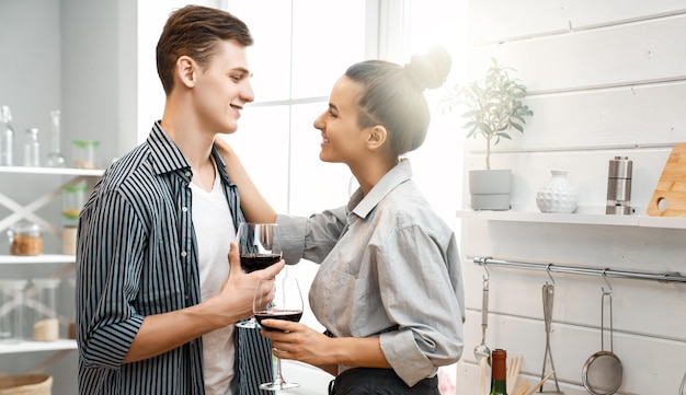 Healthy food at home Happy loving couple is preparing the proper meal in the kitchen