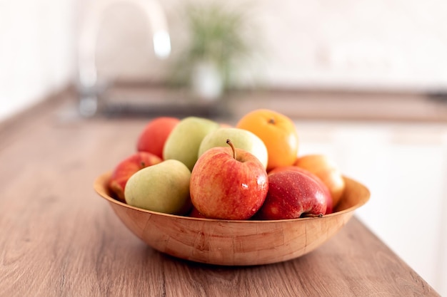 Healthy food at home healthy fruits red green apples and oranges at the table in the kitchen Healthy food baby dieting concept selective focus