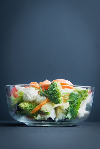 Healthy foods are on the table, Fresh vegetable salad in a glass bow