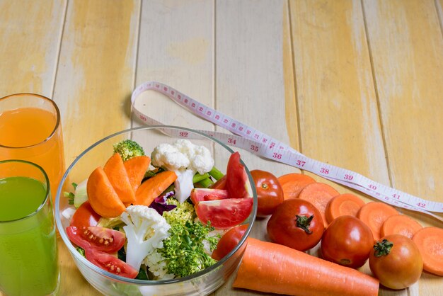 Healthy foods are on the table, Fresh vegetable salad in a glass bow