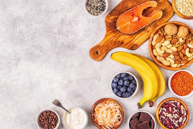 Healthy foods that lift your mood - salmon, dark chocolate, fermented foods (sauerkraut, yogurt), bananas, berries, nuts, oats, beans, lentils and coffee.