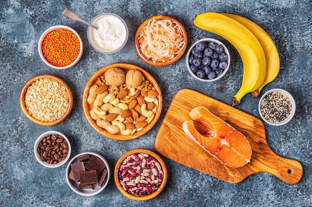 Healthy foods that lift your mood - salmon, dark chocolate, fermented foods (sauerkraut, yogurt), bananas, berries, nuts, oats, beans, lentils and coffee.