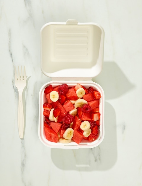 Healthy fresh fruit salad in take away box