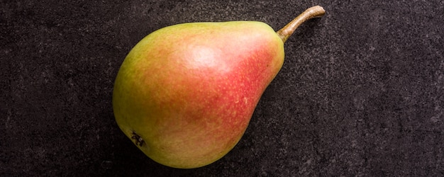 Healthy fresh pear on black Panorama view