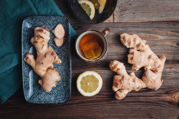 Healthy fresh raw ginger roots with lemon