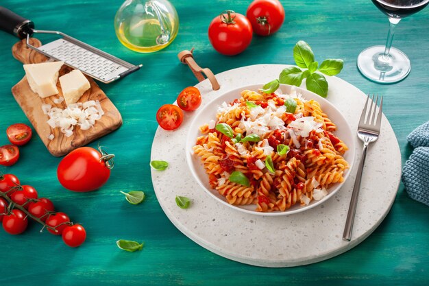 Healthy fusilli pasta with tomato sauce parmesan basil