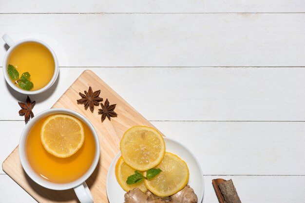 Healthy ginger tea ingredients on a wooden table