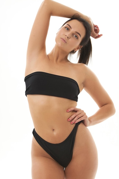 Healthy girl with toned slim body soft skin elastic buttocks thighs black bikini panties sexy back
