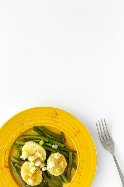 Healthy green beans with potatoes, paprika and onions