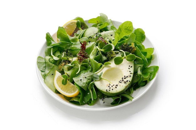 Photo healthy green salad with lettuce avocado and microgreens vegetarian meal in a bowl