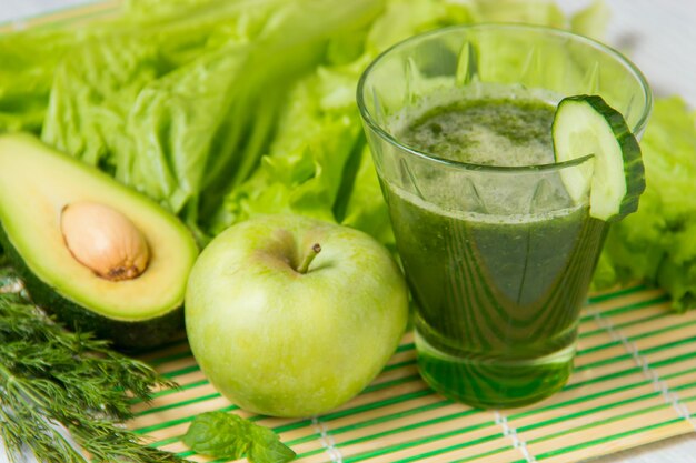 Healthy green smoothie with ingredients