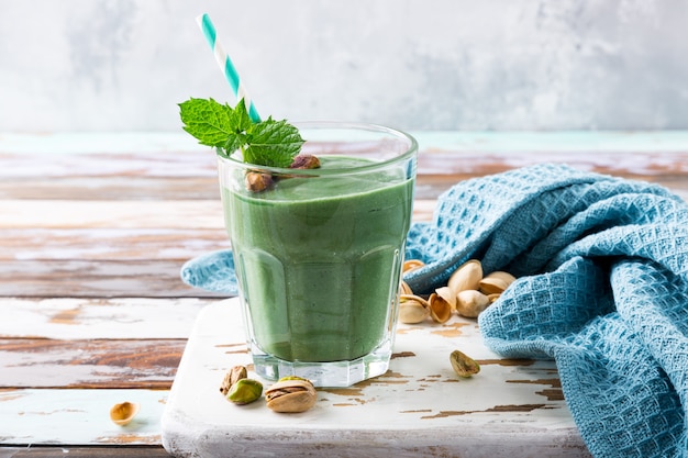 Healthy green smoothie with mint and pistachios