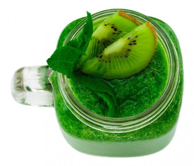 Healthy green smoothie with spinach and kiwi in a jar mug