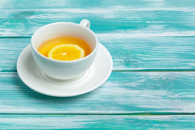 healthy herbal tea over blue background