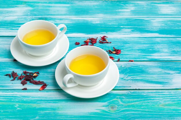 healthy herbal tea over blue background