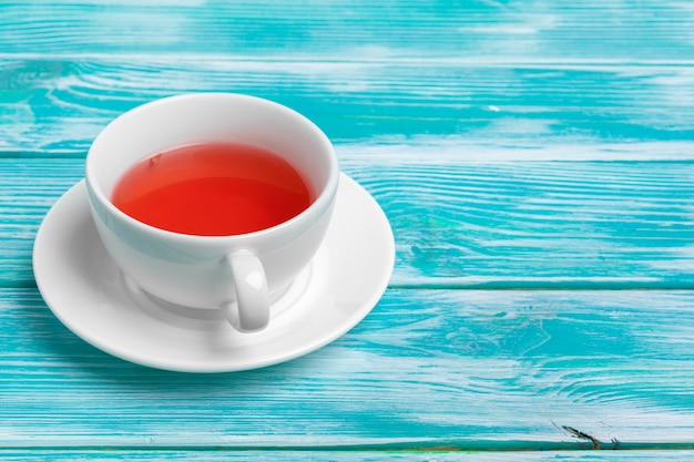 healthy herbal tea over blue background