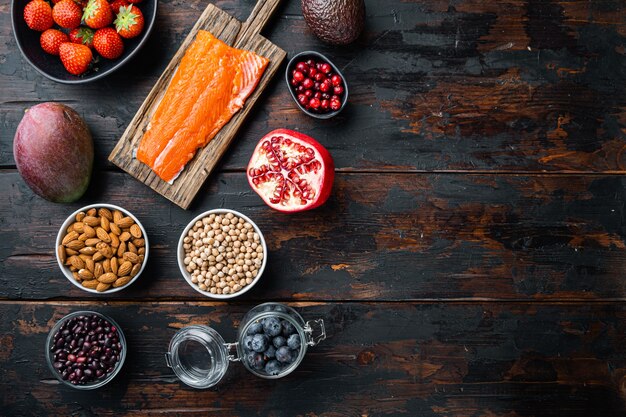 Healthy ingredients on dark wooden background