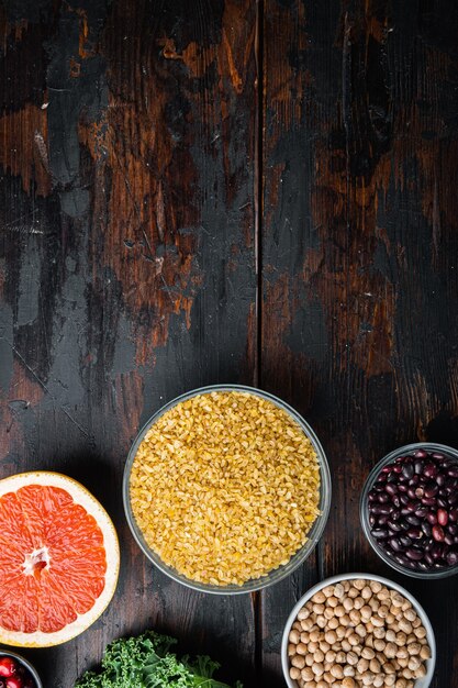 Healthy ingredients on dark wooden background