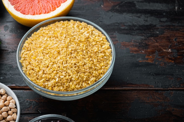 Healthy ingredients on dark wooden background