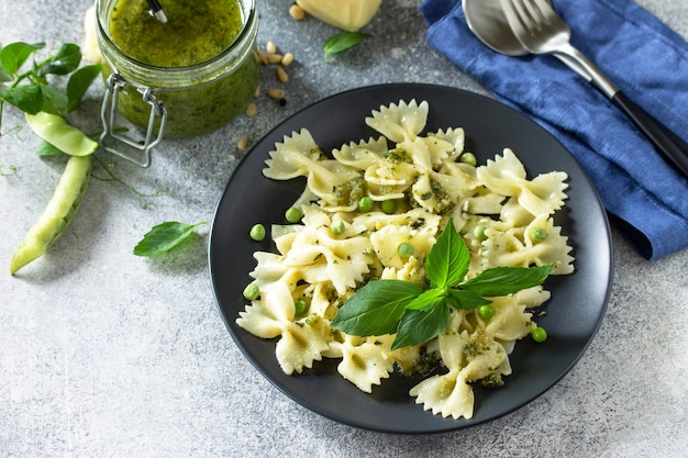 Healthy Italian cuisine Pasta with green peas and pesto sauce Copy space