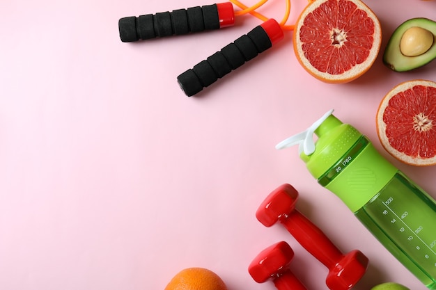 Photo healthy lifestyle accessories on pink background