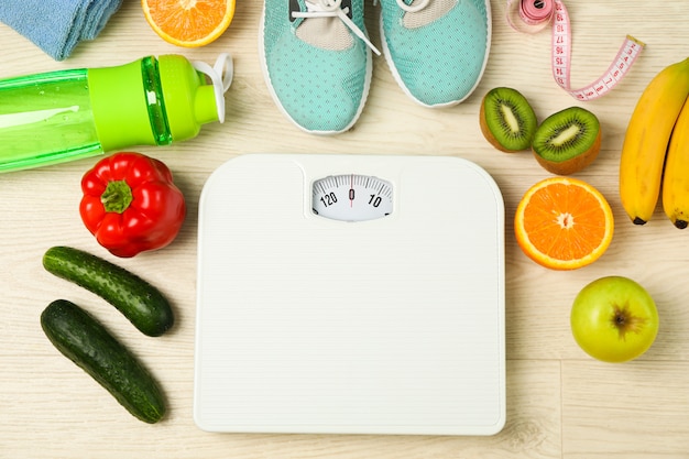 healthy lifestyle accessories on white background, top view