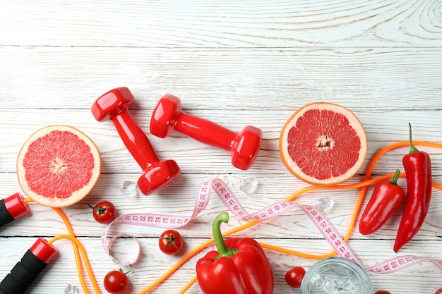 Healthy lifestyle accessories on white wooden table