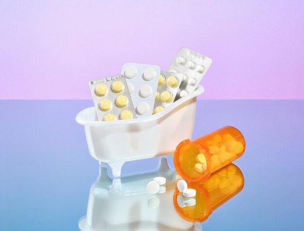 Healthy lifestyle concept Colorful medicine pills and capsules in blister packs on mirror