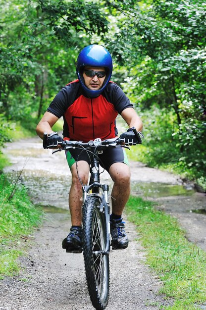 healthy lifestyle and fitness concept with mount bike man outdoor