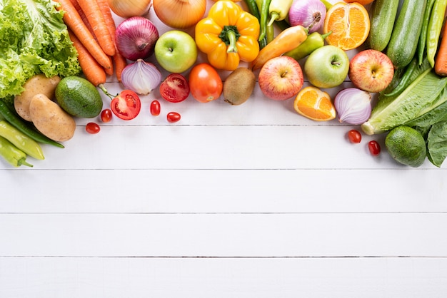 Healthy lifestyle and food concept on white wooden background.