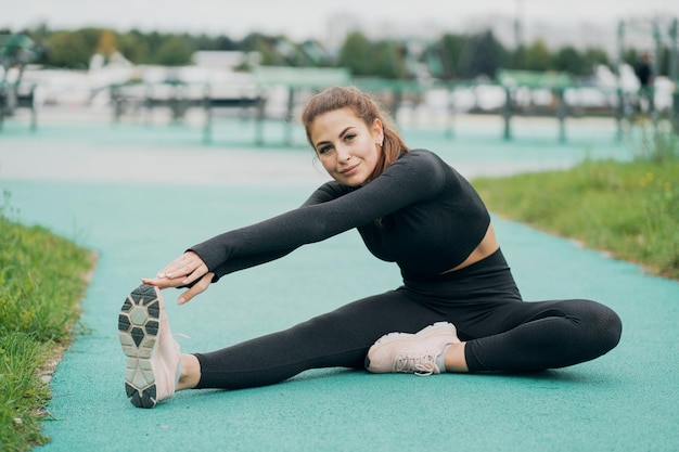 Healthy lifestyle portrait of a woman of Caucasian appearance in black tight sports