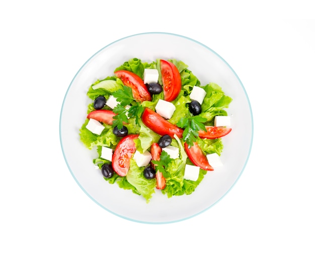 Healthy lifestyle. Vegetable diet salad with olives and goat cheese on white background.