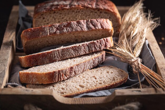 Healthy loaf of breads with grain and ears Rustic loaves of bread