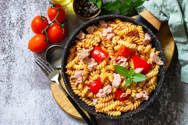 Healthy lunch Fusilli pasta with canned tuna grilled red peppers Top view Copy space
