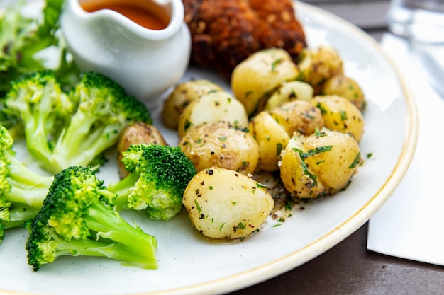 Healthy lunch in Pub with Fishcakes and baby potatoes