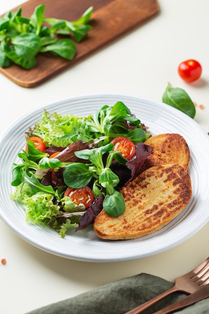 Healthy lunch vegan plant based chicken fillet steak with salad