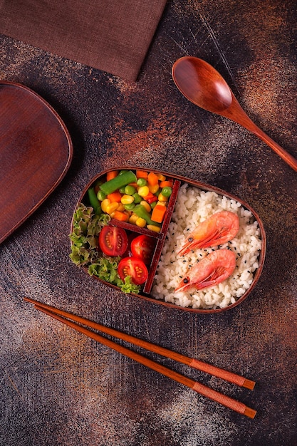 Healthy lunch in wooden japanese bento box Balanced healthy food concept