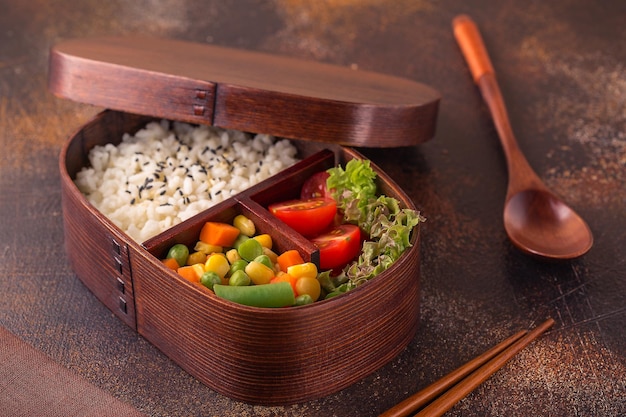 Healthy lunch in wooden japanese bento box