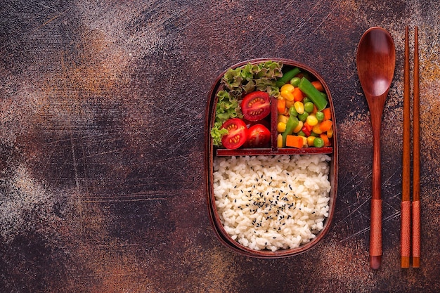 Healthy lunch in wooden japanese bento box