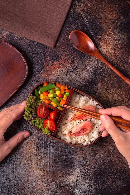 Healthy lunch in wooden japanese bento box