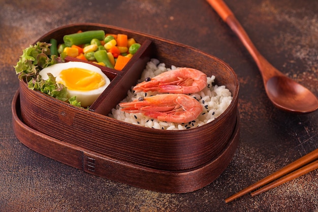 Healthy lunch in wooden japanese bento box