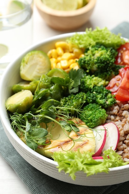 healthy meal tasty products in bowl on white table closeup
