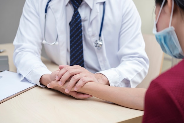 Healthy and medical concept. Doctor holding patient hand.